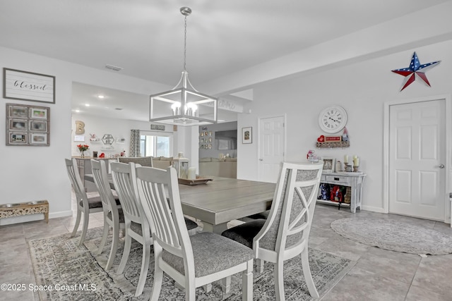 dining space with a chandelier