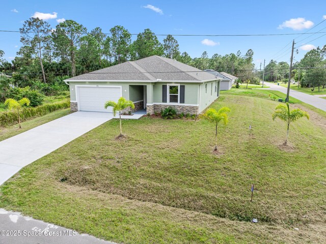 view of front of house with a garage, stone siding, a front lawn, and driveway