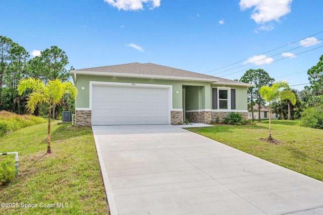 view of front of home featuring a garage, a front yard, and stucco siding