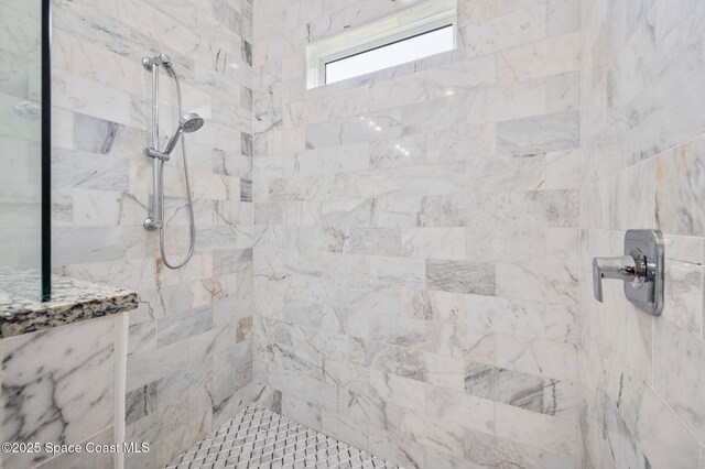 full bathroom featuring tiled shower