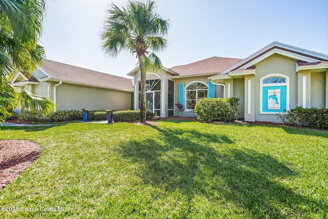 ranch-style home with a front lawn