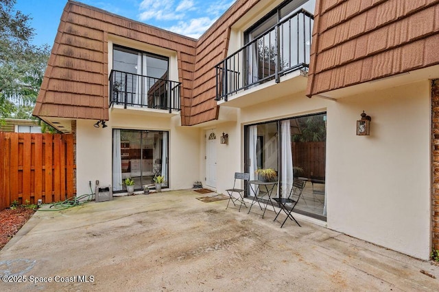 back of house with a patio area