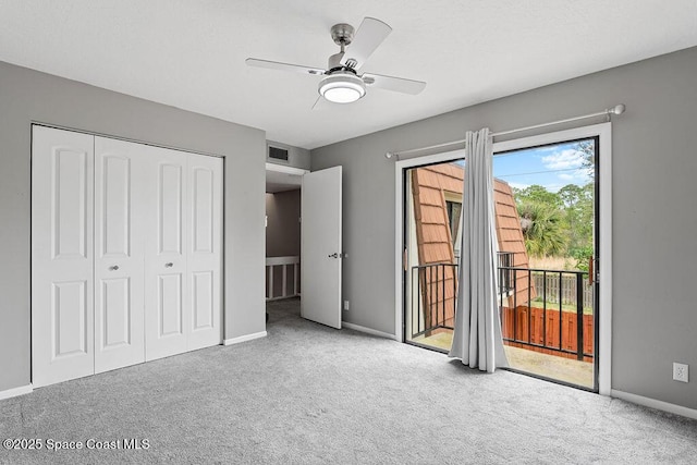 unfurnished bedroom featuring access to exterior, light colored carpet, a closet, and ceiling fan