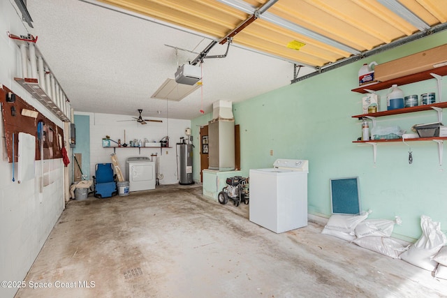 garage featuring a garage door opener, separate washer and dryer, and electric water heater