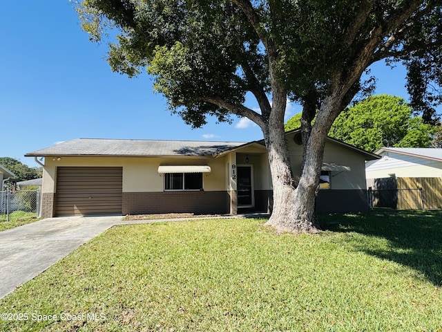 ranch-style home with driveway, brick siding, a front yard, and fence