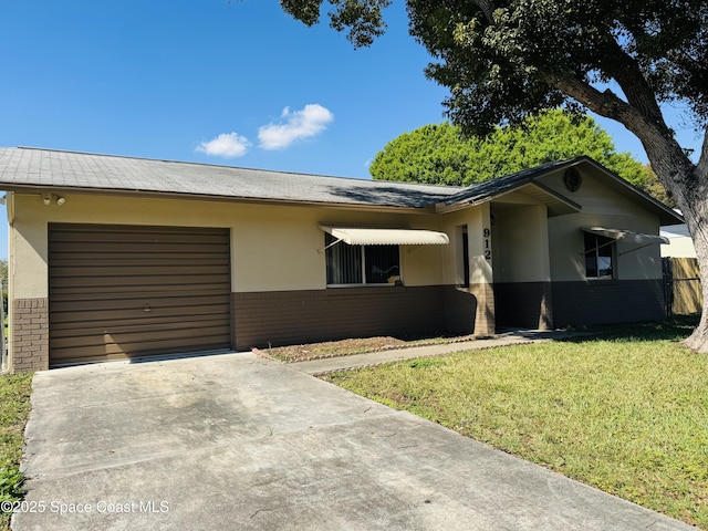 ranch-style house featuring brick siding, stucco siding, concrete driveway, an attached garage, and a front lawn