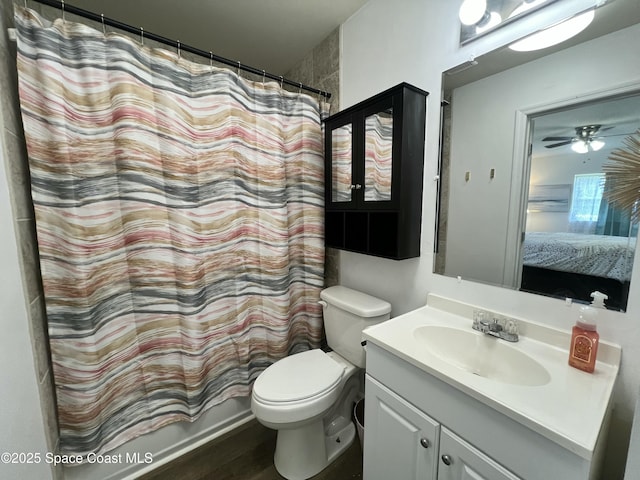 bathroom featuring vanity and toilet