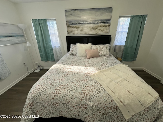 bedroom featuring dark hardwood / wood-style flooring