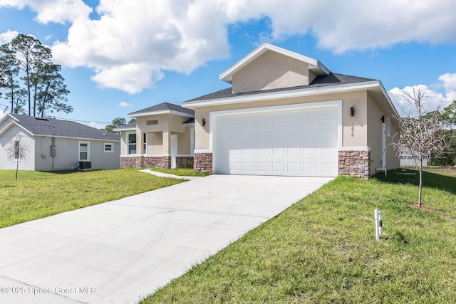 view of front of home with a garage, cooling unit, and a front lawn