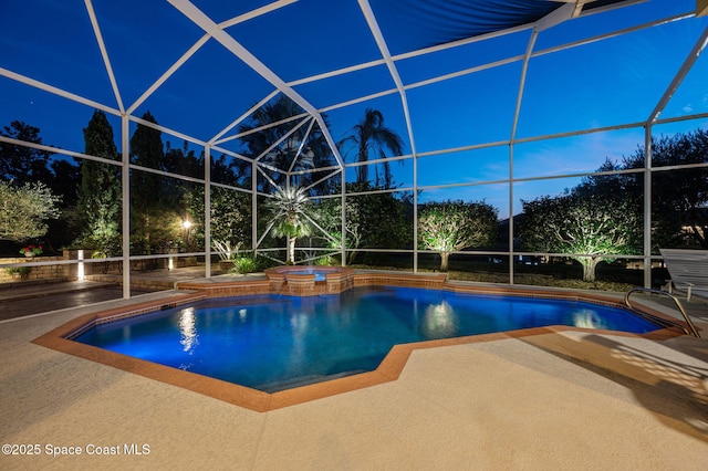 view of pool featuring a pool with connected hot tub, glass enclosure, and a patio