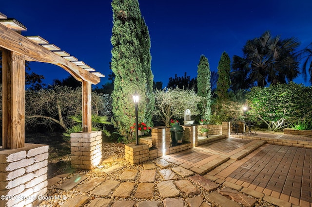 patio at twilight with a pergola