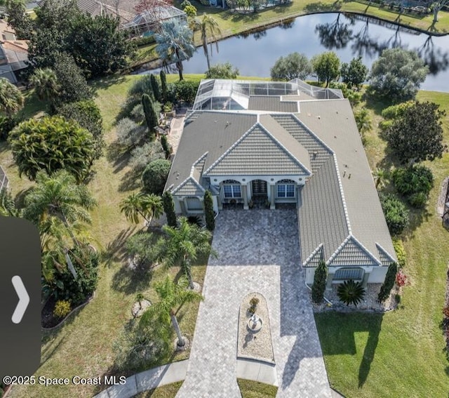 birds eye view of property with a water view