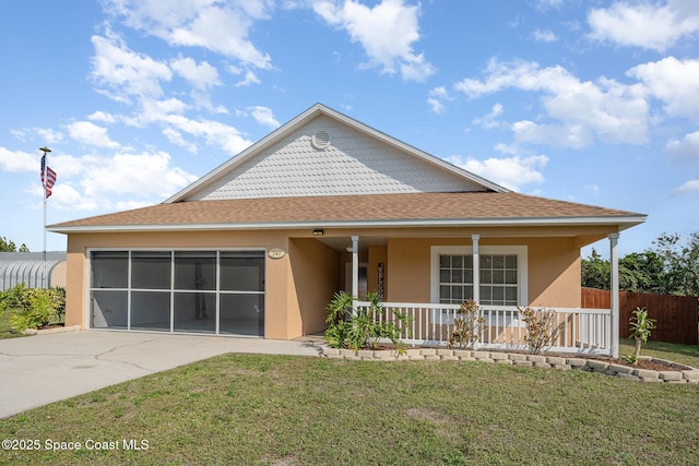 view of front facade with a porch, a garage, and a front lawn