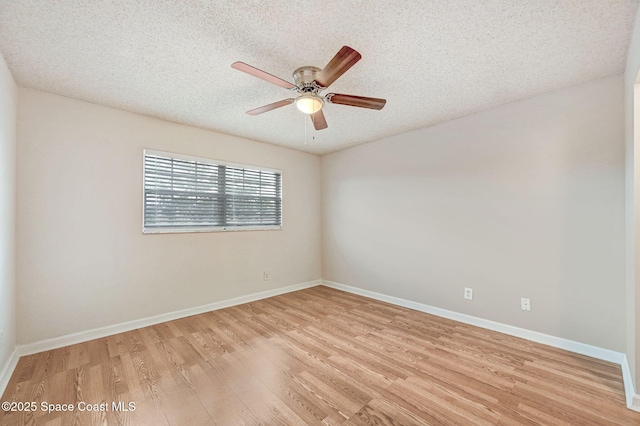 spare room with ceiling fan, a textured ceiling, and light hardwood / wood-style flooring