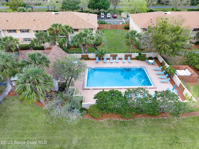 view of pool featuring a lawn and a patio area