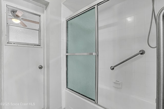 bathroom featuring ceiling fan and enclosed tub / shower combo