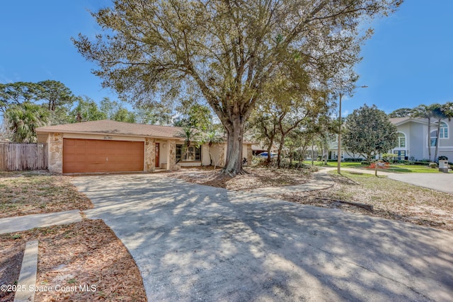 ranch-style home featuring a garage