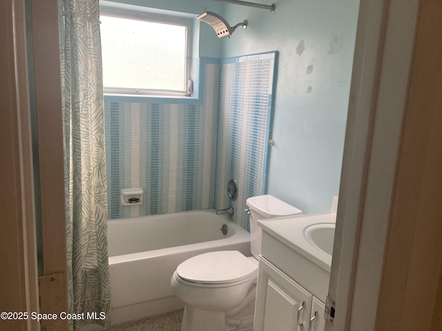 bathroom featuring shower / bath combo with shower curtain, toilet, and vanity