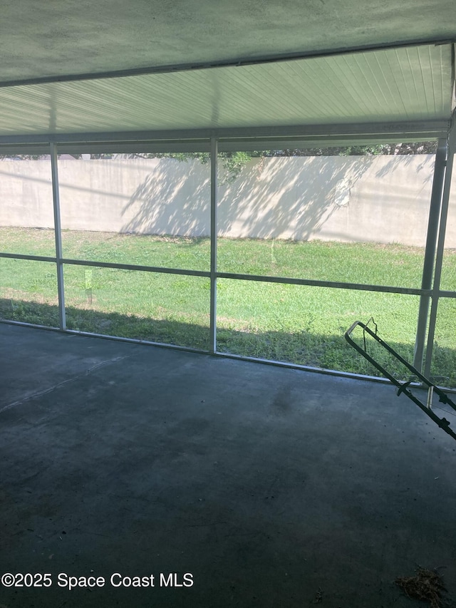 unfurnished sunroom featuring a healthy amount of sunlight