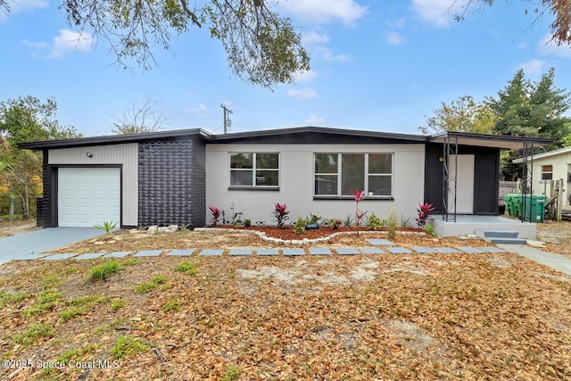 ranch-style house featuring a garage