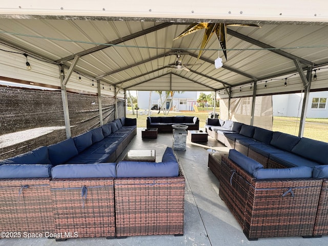 view of patio with a gazebo, ceiling fan, and an outdoor living space
