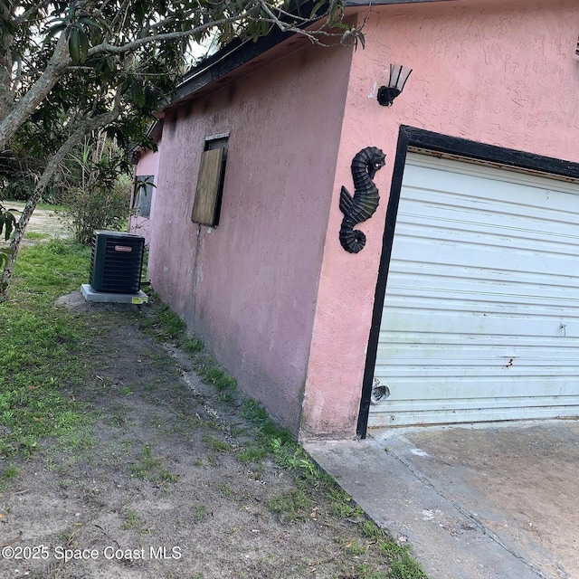 view of side of property featuring central air condition unit