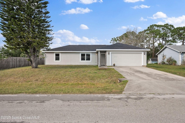 view of front of home featuring a garage and a front yard