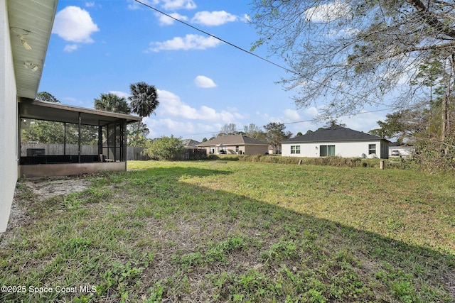 view of yard featuring a sunroom