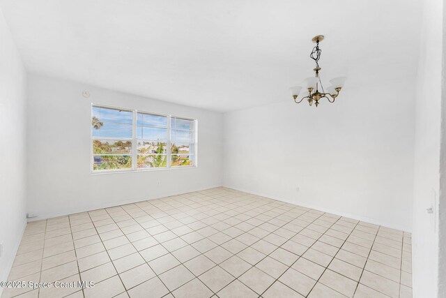 empty room with a notable chandelier