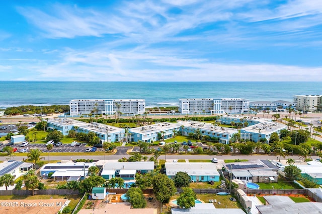 bird's eye view featuring a water view and a city view