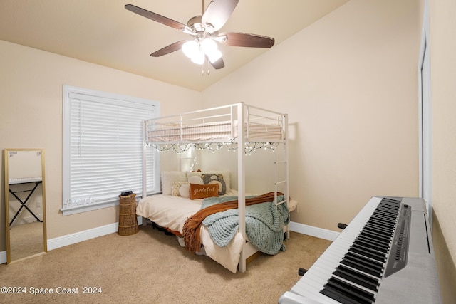 carpeted bedroom with lofted ceiling and ceiling fan