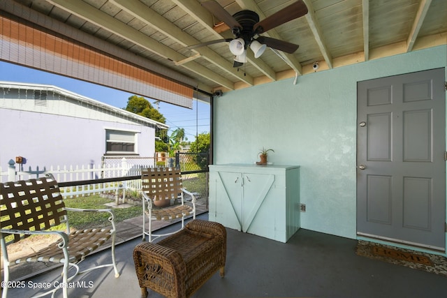 balcony featuring ceiling fan and a patio area