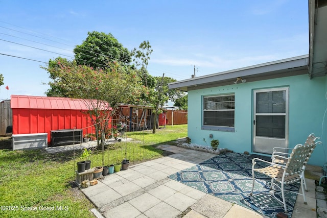 view of patio featuring a storage shed