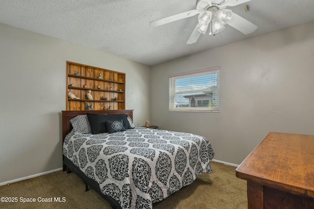 bedroom featuring ceiling fan, carpet floors, and a textured ceiling