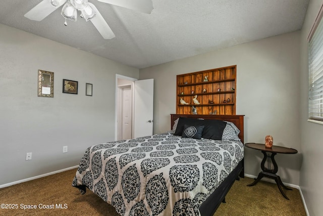 bedroom featuring ceiling fan, carpet floors, and a textured ceiling