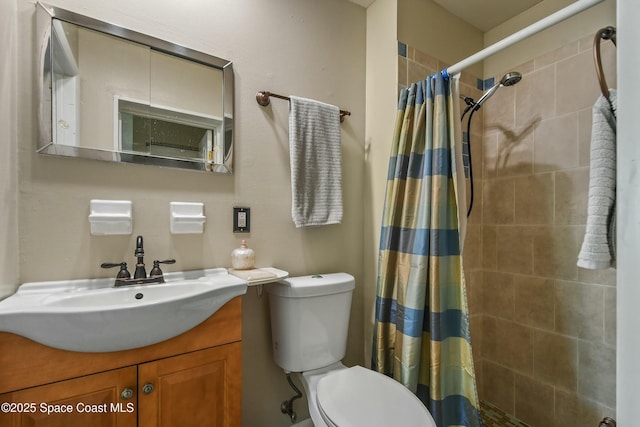 bathroom featuring vanity, toilet, and walk in shower