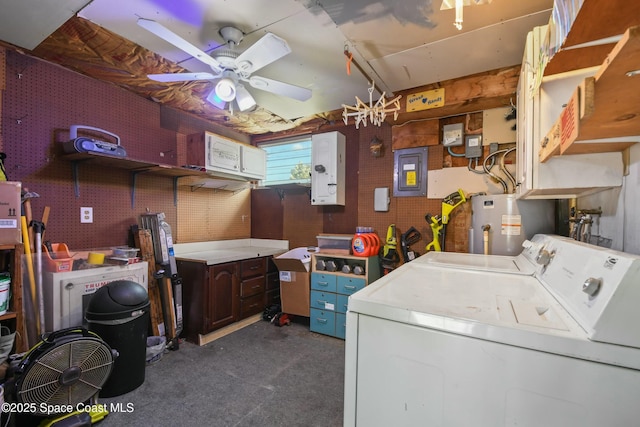 washroom with washer and clothes dryer, a workshop area, water heater, ceiling fan, and electric panel