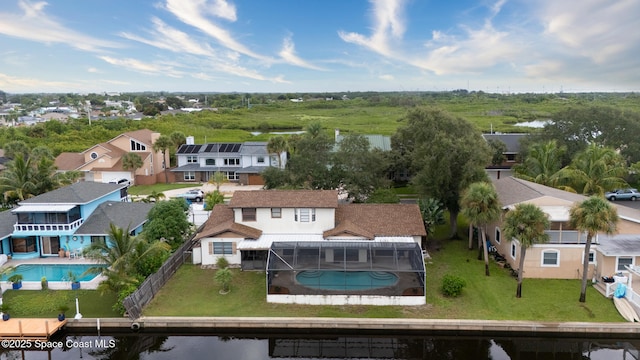 birds eye view of property featuring a water view