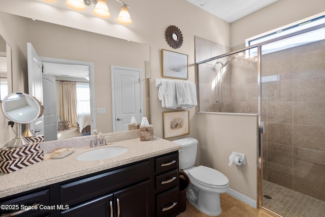 full bathroom with toilet, a shower stall, and vanity