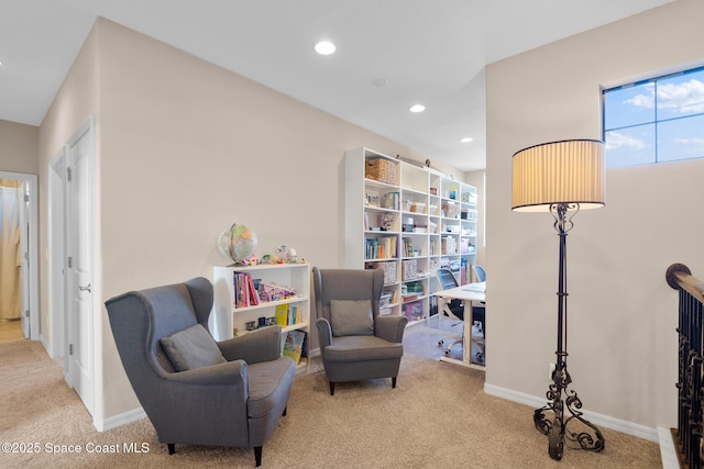 living area featuring light carpet, baseboards, and recessed lighting