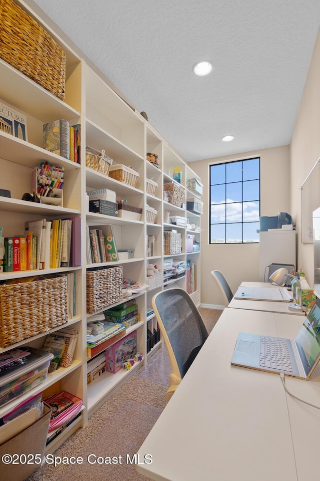 office area with a textured ceiling and recessed lighting
