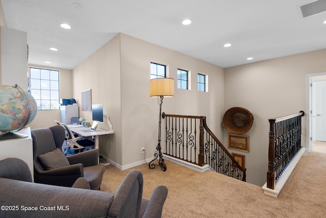 interior space with recessed lighting, visible vents, baseboards, and an upstairs landing
