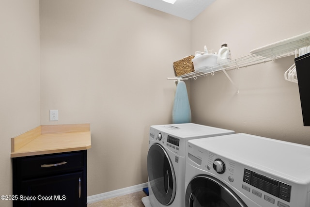 washroom with laundry area, independent washer and dryer, and baseboards