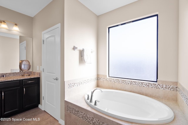 full bath with tile patterned flooring, vanity, and a bath