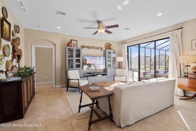 living area featuring ceiling fan, light tile patterned flooring, visible vents, and recessed lighting