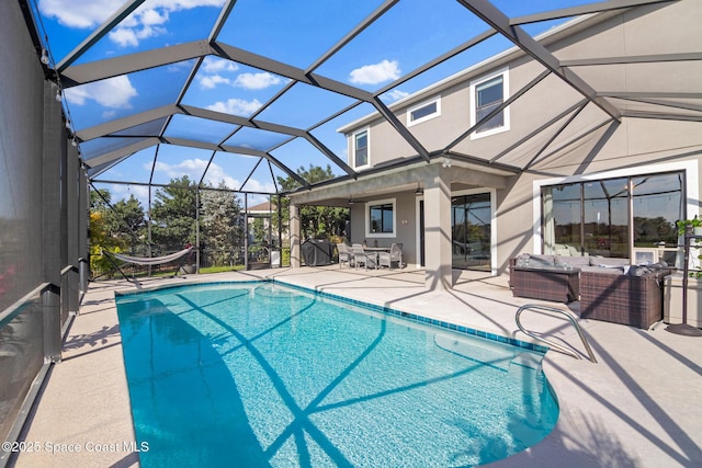 pool featuring a lanai, a patio area, and outdoor lounge area