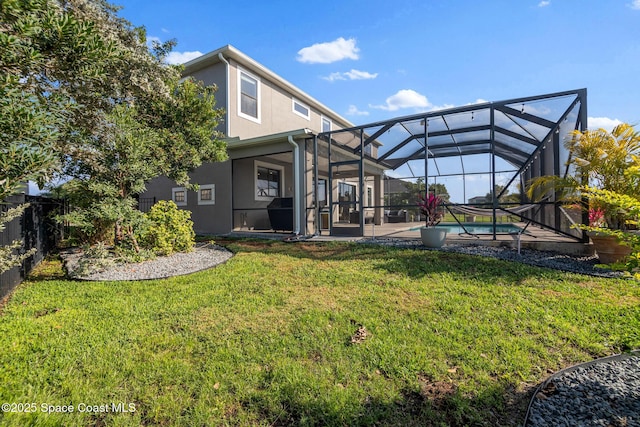 back of house with an outdoor pool, a lawn, glass enclosure, fence, and stucco siding
