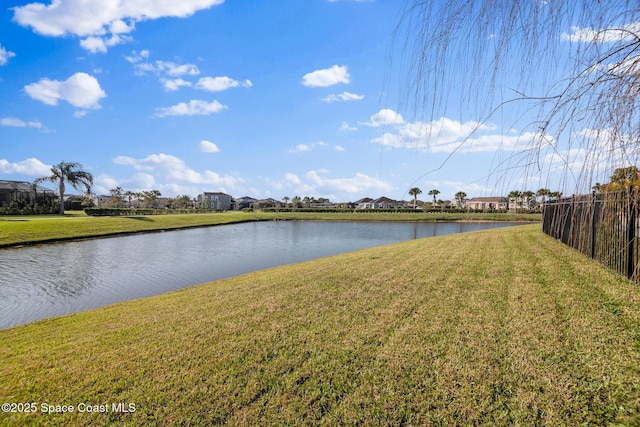 property view of water featuring fence