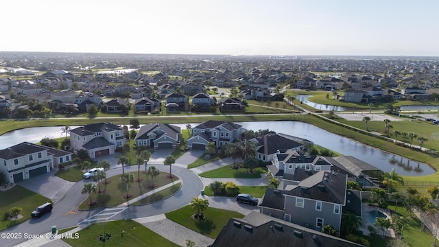 aerial view with a residential view and a water view
