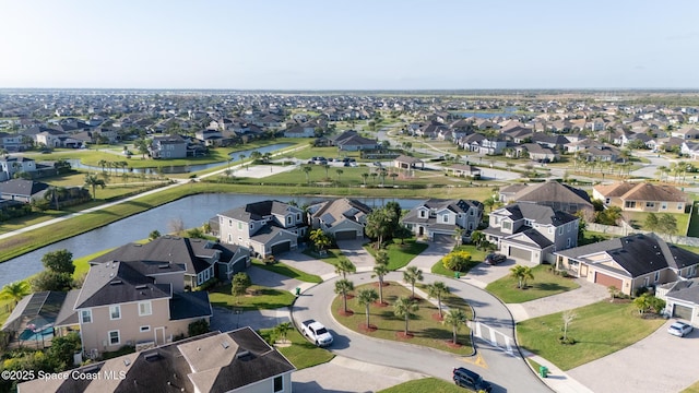 bird's eye view with a water view and a residential view